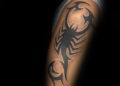Unique Tribal Scorpion Tattoo For Men on Upper Arm