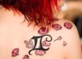 Gemini Tattoo Design For Women on Shoulder of Flowers and Symbol
