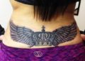 Lower Back Tattoo Design of Crown and Wings