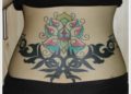 Lower Back Tattoo Design of Flower and Tribal For Women