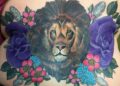 Lower Back Tattoo Design of Lion and Flowers