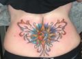 Lower Back Tattoo Design of The Sun For Women