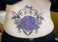 Lower Back Tattoo of Purple Flower For Women